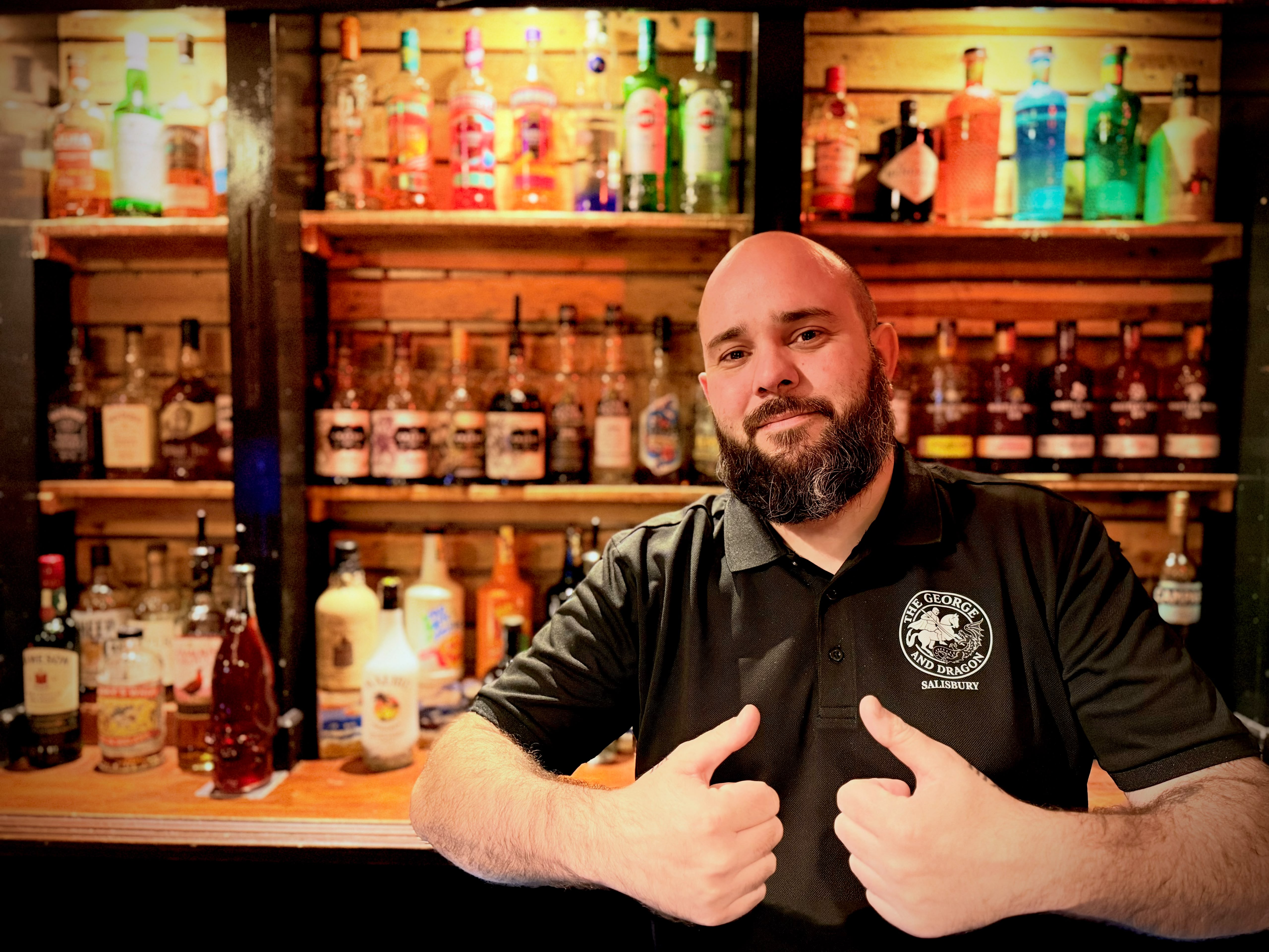 Friendly staff welcoming guests behind the bar at The George & Dragon Salisbury